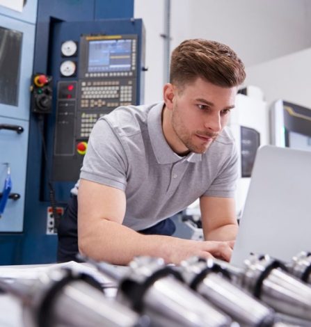 Man with laptop in the workshop